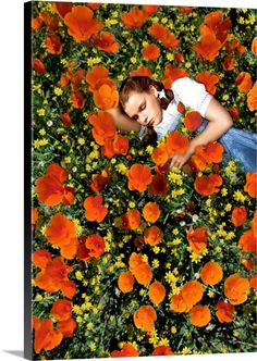 a woman in a field of red flowers