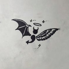 an image of a bat and angel tattoo on a white paper sheet with black ink