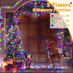 a christmas tree with lights and reindeer figurines in front of an open door