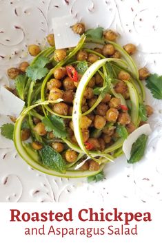 roasted chickpea and asparagus salad on a white plate with text overlay