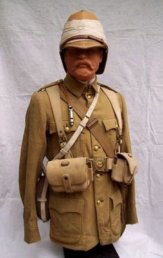 an old soldier's uniform is displayed on a mannequin head and foot