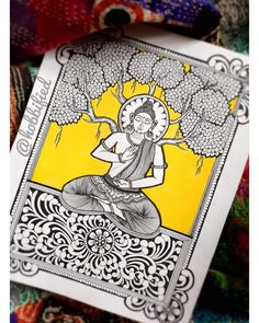 a card with an image of a buddha sitting in the middle of it, surrounded by other cards