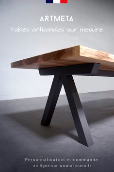 a wooden table sitting on top of a cement floor