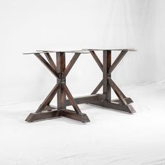 two wooden tables sitting side by side on top of each other in front of a white background