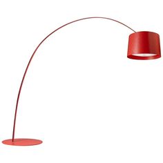 a floor lamp with a red shade on the base and a white light behind it