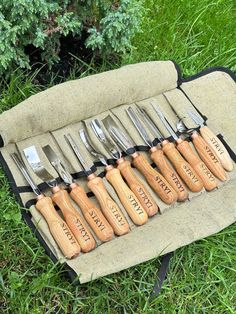 a set of knives in a case on the grass