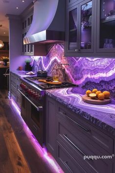 a kitchen with purple marble counter tops and cabinets