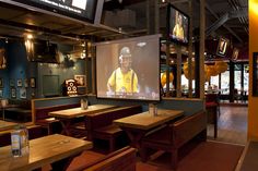 a large screen in the middle of a restaurant