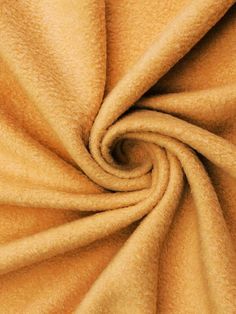 a close up view of a yellow fabric