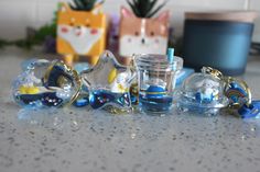 a group of glass ornaments sitting on top of a counter