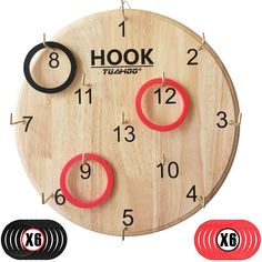 a wooden clock with red and black numbers on it