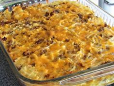 a casserole dish with meat and cheese in it sitting on a counter top