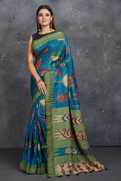 Buy stunning blue pen Kalamkari saree online in USA with green border. Keep your ethnic wardrobe up to date with latest designer sarees, pure silk sarees, Kanchipuram silk sarees, handwoven sarees, tussar silk sarees, embroidered sarees from Pure Elegance Indian saree store in USA.-full view Silk Sarees Kanchipuram, Kalamkari Sarees, Silk Sarees Online Shopping, Blue Pen, Green Border, Kalamkari Saree