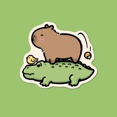 a brown hippo standing on top of a green alligator's back end with an egg in its mouth