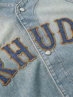 It's easy to spot the baseball influences behind Rhude's shirt. Appliquéd with the moniker like a team name across the chest, it's cut for a relaxed fit from faded denim and has logo-engraved snap fastenings down the front. Vintage Apparel Design, Logo Patch Design, Rhude Aesthetic, Rhude T Shirt, Denim Shirt For Men, Rhude Sweatshirt, Rhude Shorts, Blue Cotton T-shirt With Embroidered Logo, Hoodie Rhude