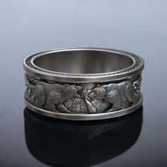 This Nordic Viking Polar Bear Wedding Band is a handcrafted masterpiece made from premium 925 sterling silver, offering a unique blend of Viking symbolism and modern elegance. The ring features a bold and intricately detailed polar bear design, symbolizing strength, resilience, and the untamed spirit of the North. Perfect for those who admire Nordic mythology or have a deep connection with nature, this wedding band stands out as a statement piece. The durable silver construction ensures longevit Animal Symbol, Nordic Mythology, Symbol Jewelry, Bear Wedding, Unique Wedding Ring, Viking Ring, Masonic Ring, Retro Ring, Symbolic Jewelry