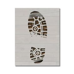 two pairs of shoes are cut out from wood planks with the word, foot prints