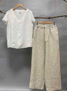 "Classic yet chic relaxed fit linen pants is your wardrobe smart staple. Our Ocean pants are made from 100% linen fabric in earth tone colors, enriching season-spinning versatility from home to office, work to leisure. -100% linen -Straight silhouette -Easy, comfortable, and just right voluminous. -Flat front -Pull-on style -Elastic waistband with pull ribbon (Optional) -2 side welt pockets -Color in listing: Chocolate, Black, Burnt Orange, White, Teal Please provide your natural waist, lower hi Classic Cotton Work Pants, Women Petite Pants Linen, Luxury Flax Pants For Summer, Affordable Light Wash Cotton Pants, Luxury Linen Straight Kurta Set, Casual Pants For Daywear, Affordable Summer Pants With Button Closure, Affordable Wide-leg Cotton Pants, Cheap Linen Trousers