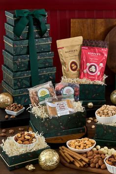 a table topped with lots of different types of food and snacks on top of each other