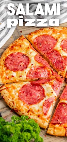 A close up of a sliced salami pizza.