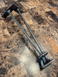 a metal object sitting on top of a tiled floor