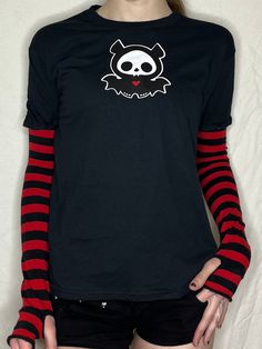 This item is hand printed on a 100% cotton t-shirt with an Acidcore label.  Red & black stripe sleeves sewn into the top with thumb holes & fingerless gives this top grunge goth vibes. The sleeves are available in the following colours: red & black, purple & black, white & black.  About Me:  Acidcore is my store based in London. All my items are hand printed with hand made transfers and some are hand embellished. My designs are inspired by different genres, gothic, fairycore, cottagecore, punk, indie. Red And Black Clothes, Red T Shirt Outfit, Scenecore Clothes, Scene Shirts, Cottagecore Punk, Gothic Fairycore, Emo Designs, 2000 Clothes, Scene Shirt