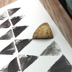 a potato sitting on top of a piece of paper