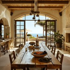 a dining room table and chairs with an open door leading to the outside patio area