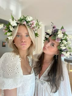 two women with flower crowns on their heads