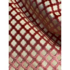 a red and white checkered fabric with an interesting pattern on it's surface