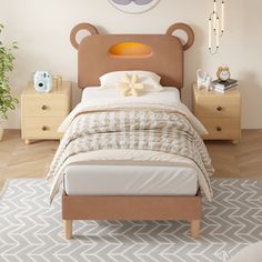 a bedroom with a teddy bear head on the wall next to a bed and nightstands