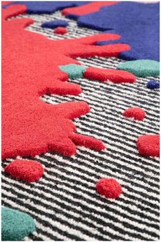 an area rug with different colors and shapes