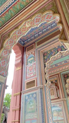 an intricately painted wall and doorway in a building