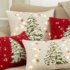 three pillows with christmas trees on them