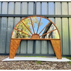 a mirror sitting on top of a wooden bench