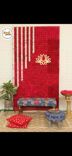 a room decorated with red flowers and decorations