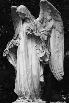 black and white photograph of an angel statue