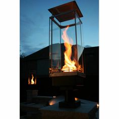 a fire pit sitting on top of a cement slab