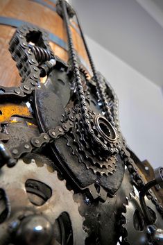 an old clock made out of metal gears