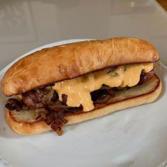 a sandwich with meat and cheese on a plate