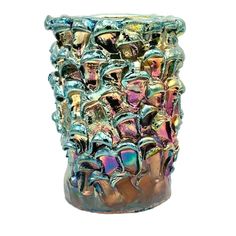 a glass vase filled with lots of metallic objects