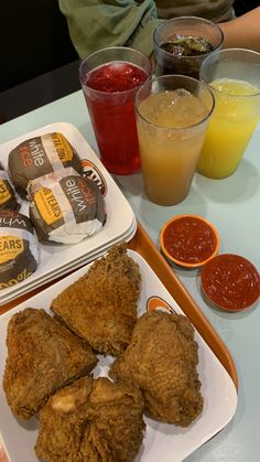 fried food and drinks on a table at a restaurant