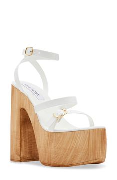 A wood-grain heel and platform play up the retro appeal of a lofty, strappy sandal embellished with a slim ankle strap. 5 3/4" heel; 2 1/4" platform Adjustable ankle strap with buckle closure Synthetic upper, lining and sole Made in Italy Sandal Women, Strappy Sandals, Platform Sandals, Wood Grain, Shoes Women Heels, Steve Madden, Ankle Strap, Womens Sandals, Grain