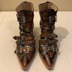 Brand: Ras Size: 7.5 Color: Brown Snakeskin Good Pre-Owned Condition Normal Wear Smoke And Pet Free Environment Defects: None Material: Leather Bin#80 Source Code Heeled Ankle Boots, Snake Skin, Leather Heels, Bootie Boots, Ankle Boots, Women Shoes, Boots, Heels, Women Shopping