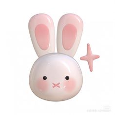 a pink and white bunny shaped object with a star on it's side,