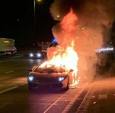 a car that is on fire in the street