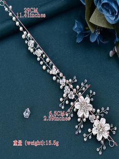 an image of a bridal hair comb with flowers and pearls on the headband