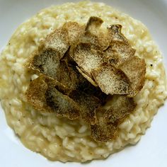 a white plate topped with oatmeal covered in sugar