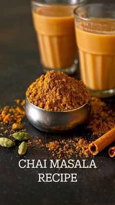 two cups filled with cinnamon and spices next to each other