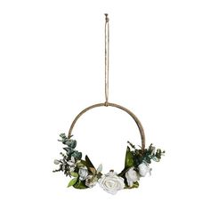 a white flower wreath hanging from a rope